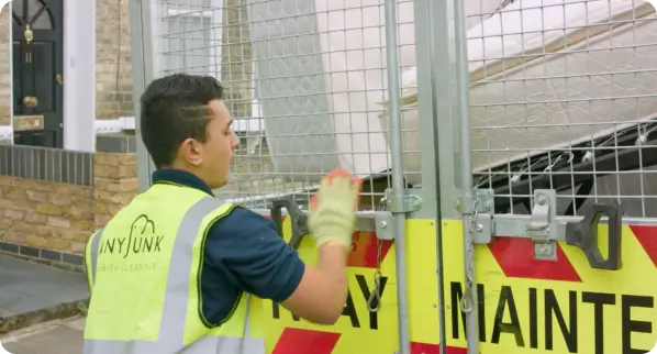 Service partner loading waste into a truck